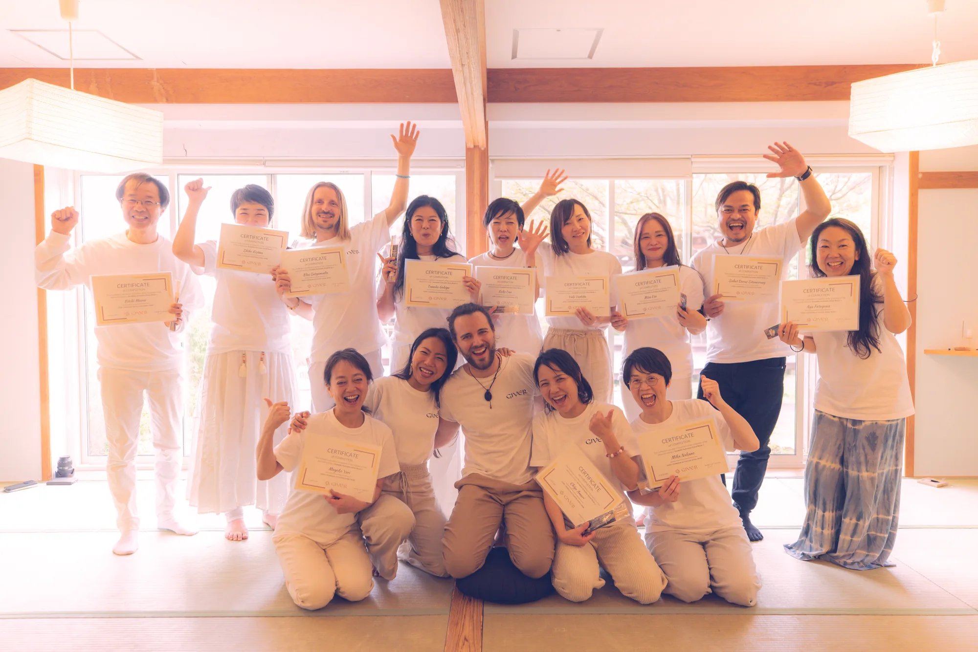 2024 GIVER® Kundalini Activation Astral Work facilitator training graduates celebrating with certificates in Japan