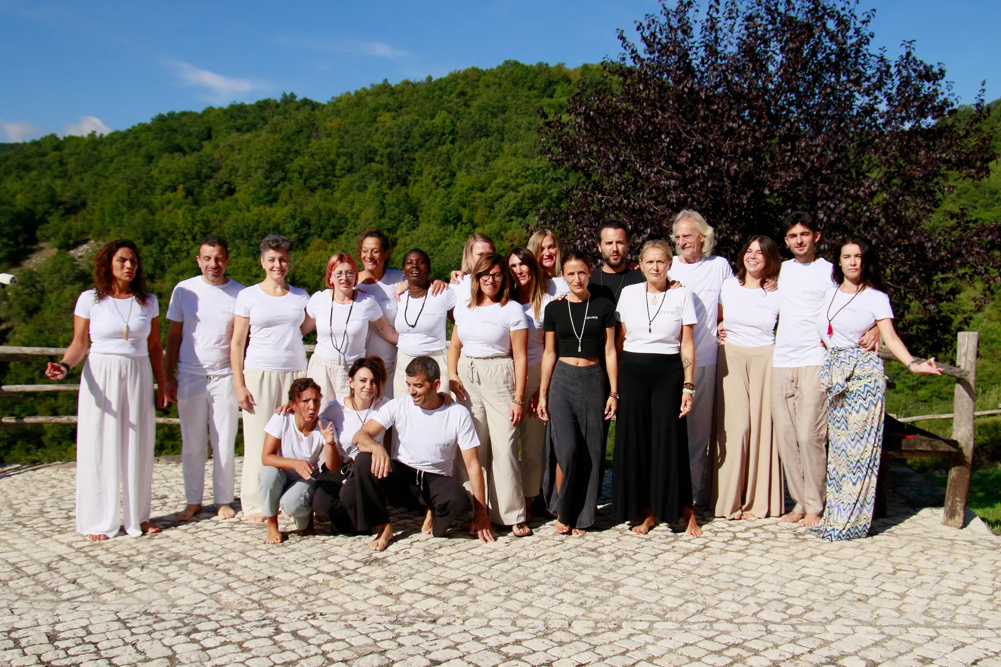Second 2025 GIVER® Kundalini Activation Astral Work training group photographed outdoors in the Italian hills