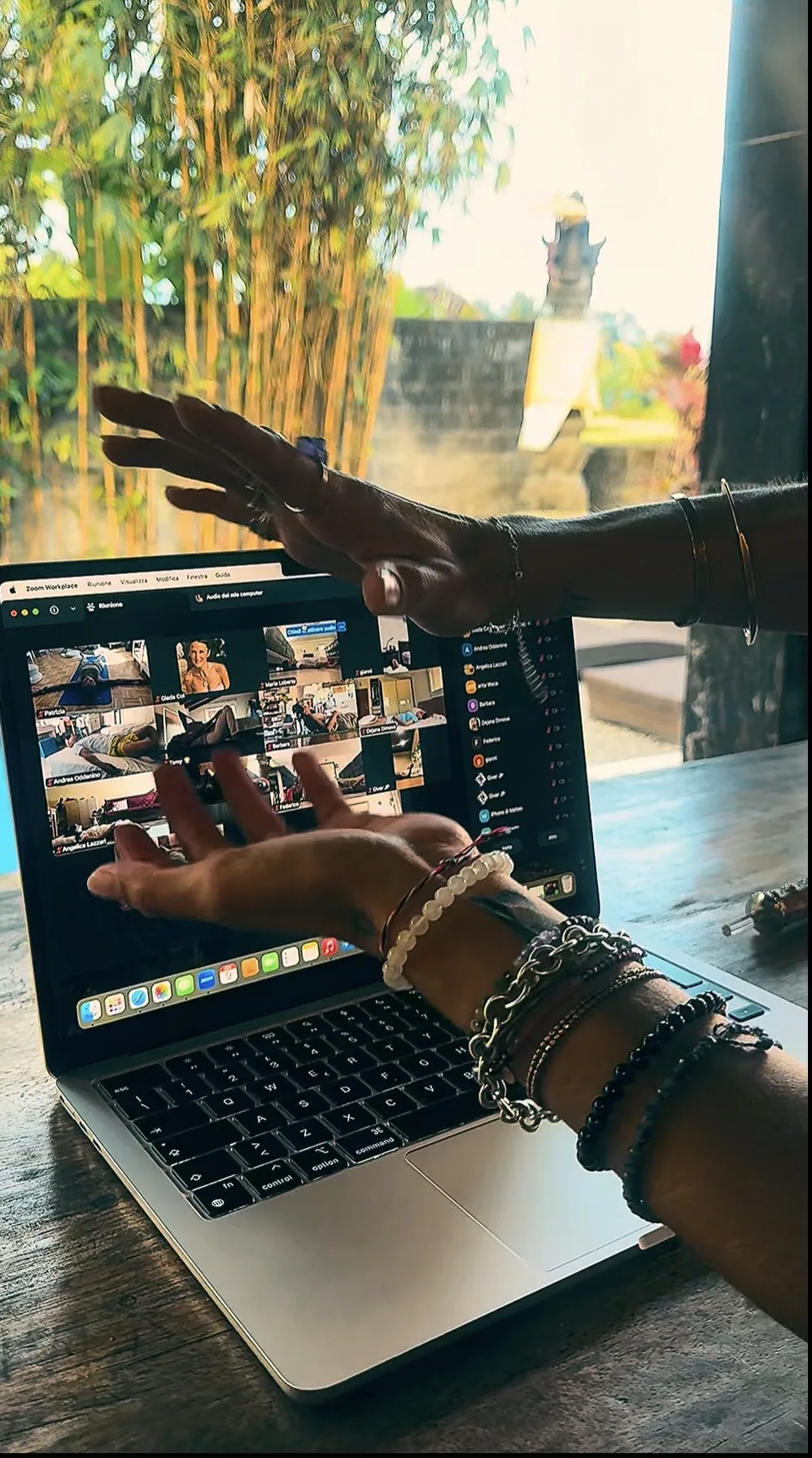 GIVER® facilitator's hands extended over a laptop during a live online Kundalini Activation Astral Work session
