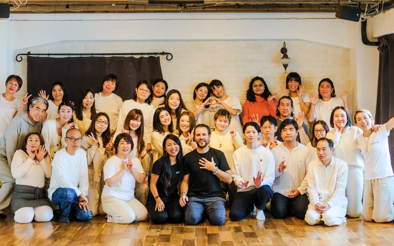 Participants and facilitators after a GIVER® Kundalini Activation Astral Work session in a Tokyo studio
