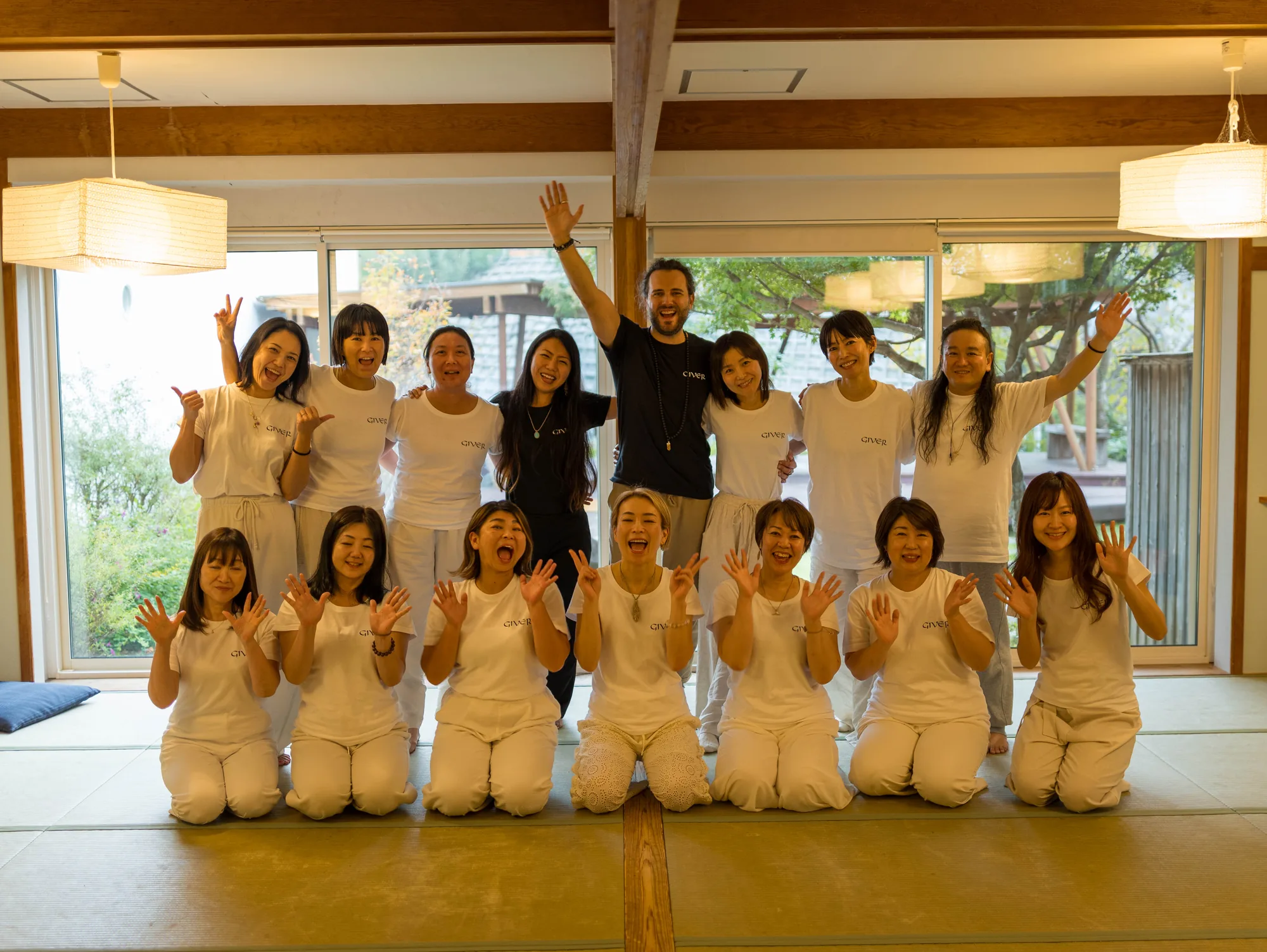 GIVER® Kundalini Activation Astral Work facilitator training group in Japan celebrating with raised hands