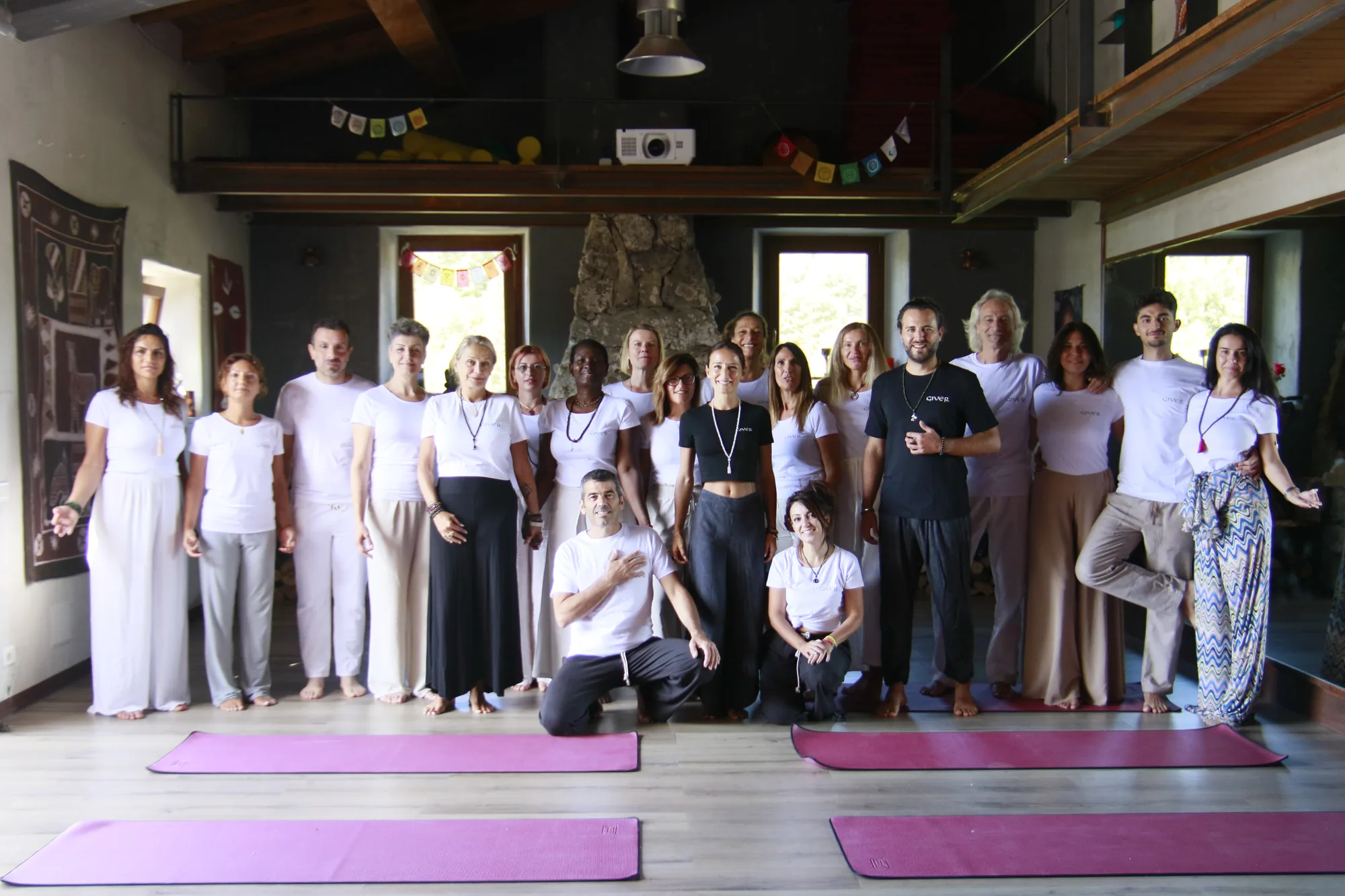 GIVER® Kundalini Activation Astral Work facilitator training group portrait in an Italian retreat hall